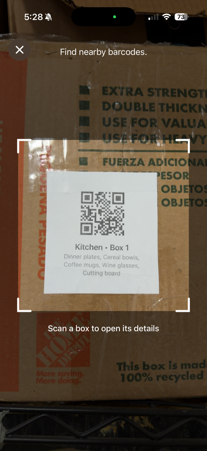 Camera scanning a QR label on a moving box